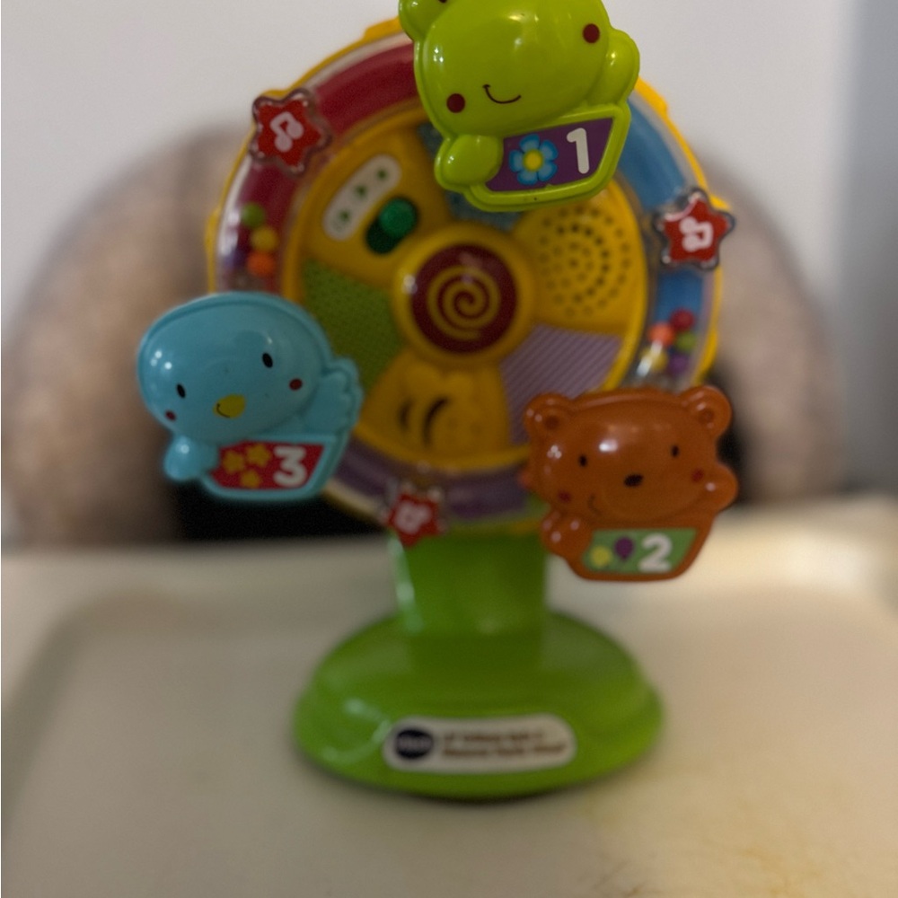 Whimsical Green and Blue Learning Toy Carousel